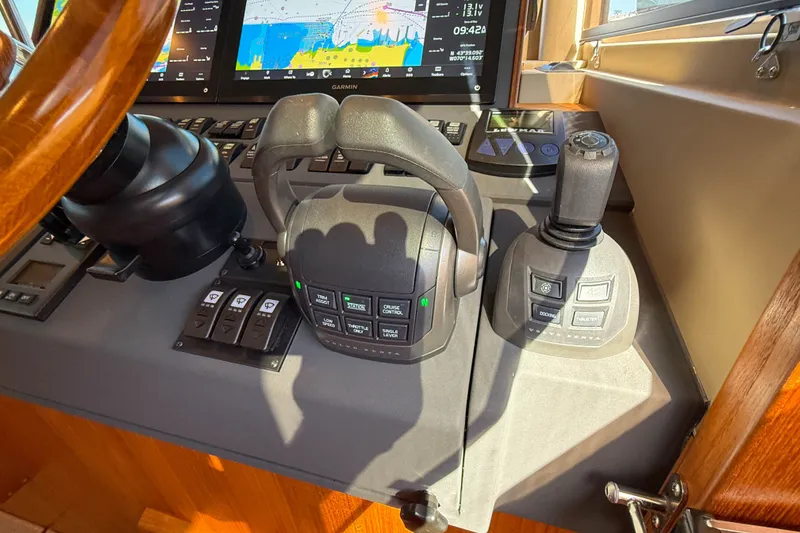 Slide: The Image of Control panel of 2026 Targa 41 boat with navigation and throttle systems. - 34