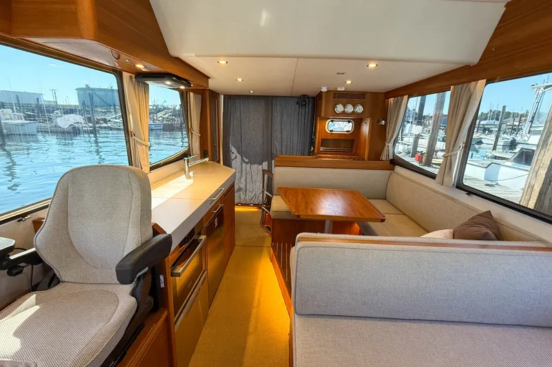 Slide: The Image of Interior of 2026 Targa 41 yacht with modern seating and panoramic windows. - 44