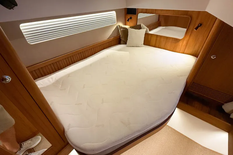 Slide: The Image of Luxurious cabin interior of 2026 Targa 41 yacht with cozy bed and wooden accents. - 48