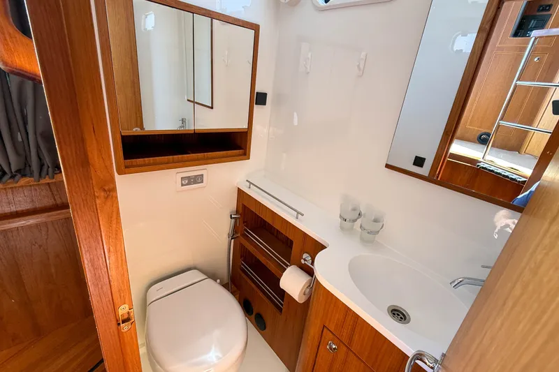 Slide: The Image of Luxurious bathroom interior of 2026 Targa 41 yacht with wooden cabinetry and modern fixtures. - 52