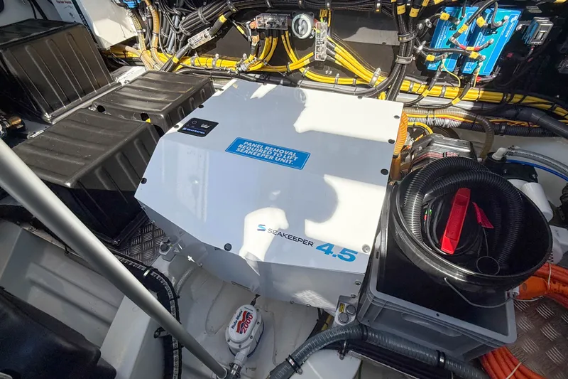 Slide: The Image of Engine room of 2026 Targa 41 featuring Seakeeper 4.5 stabilizer and organized wiring. - 61
