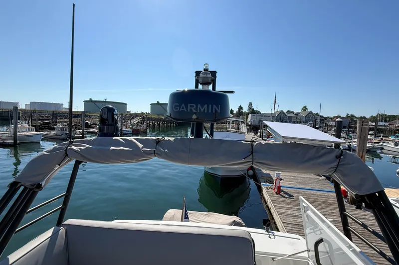 Slide: The Image of Targa 41 boat docked at marina, featuring Garmin equipment, 2026 model. - 17