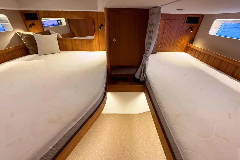 Slide: The Image of Luxurious cabin interior of 2026 Targa 41 yacht with twin beds and wooden finish. - 47