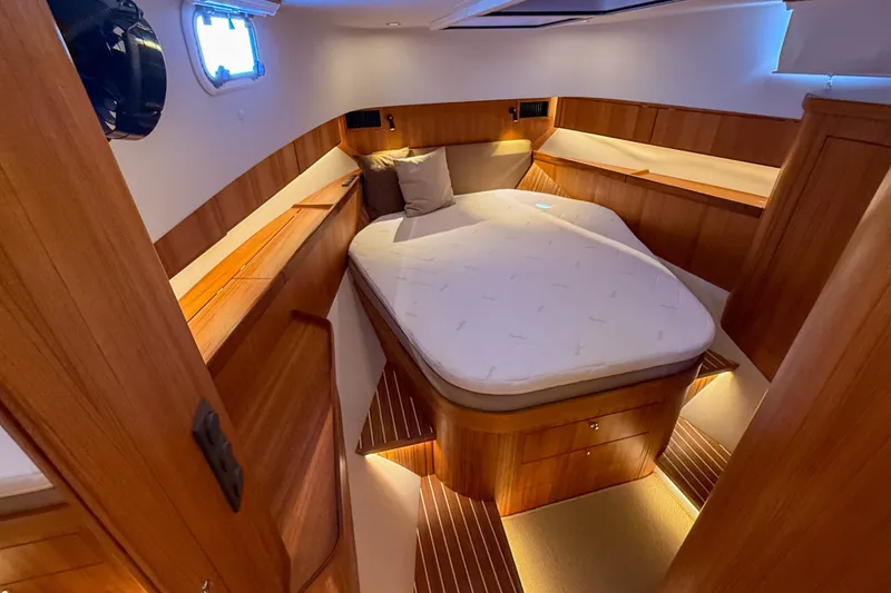 Slide: The Image of Luxurious cabin interior of 2026 Targa 41 yacht with wooden finishes and cozy bed. - 37