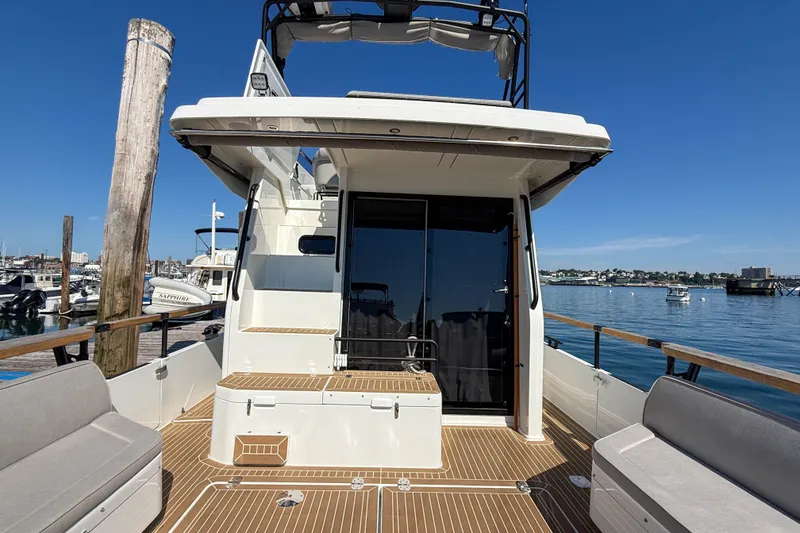 Slide: The Image of 2026 Targa 41 yacht docked, featuring spacious deck and modern design. - 19