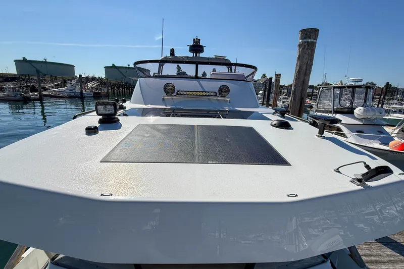 Slide: The Image of 2026 Targa 41 yacht docked at marina, showcasing sleek design and modern features. - 56