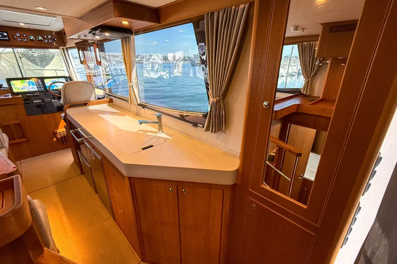 Slide: The Image of Luxurious interior of 2026 Targa 41 yacht with modern kitchen and panoramic windows. - 21