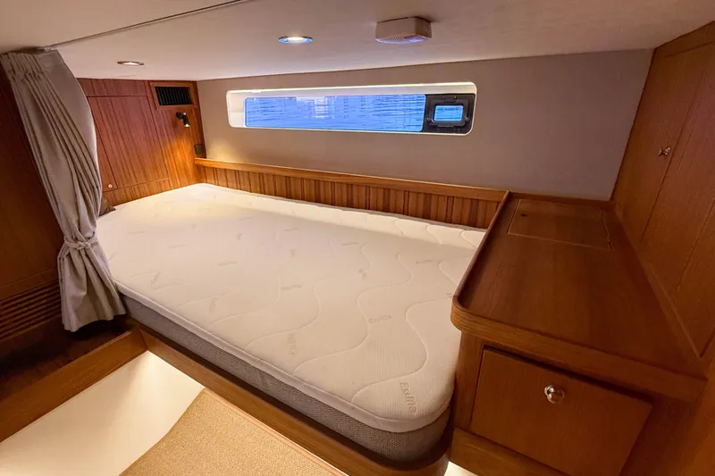 Slide: The Image of Luxurious cabin interior of 2026 Targa 41 yacht with wooden furnishings and cozy bed. - 49