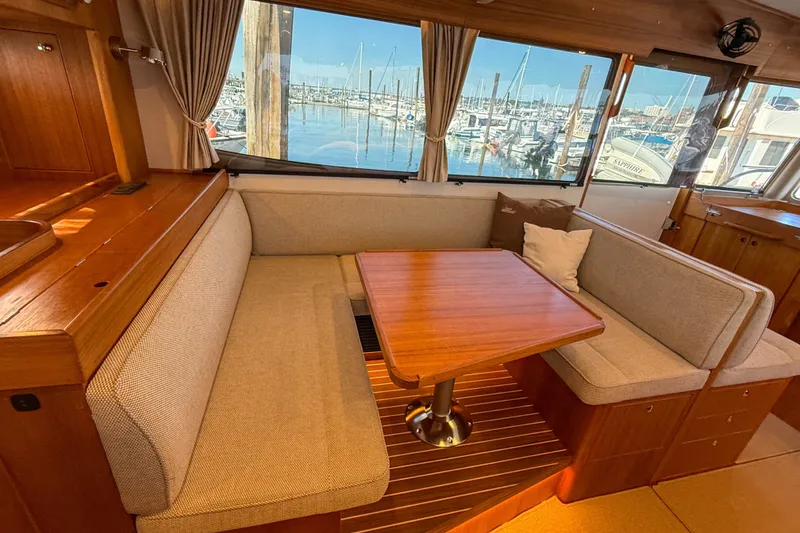 Slide: The Image of Luxurious interior of 2026 Targa 41 yacht with cozy seating and marina view. - 26