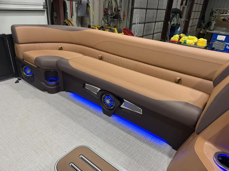Slide: The Image of Luxurious seating with blue LED lighting and speakers in a modern boat. - 33
