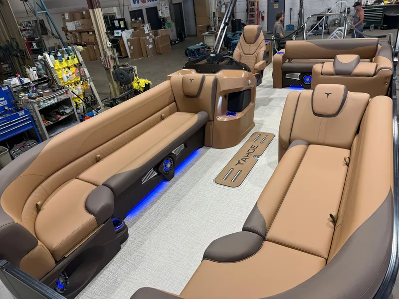 Slide: The Image of Luxurious interior of a 2027 Tahoe LTZ 300HP VRB 2385 Swingback Tritoon with sleek leather seating. - 35