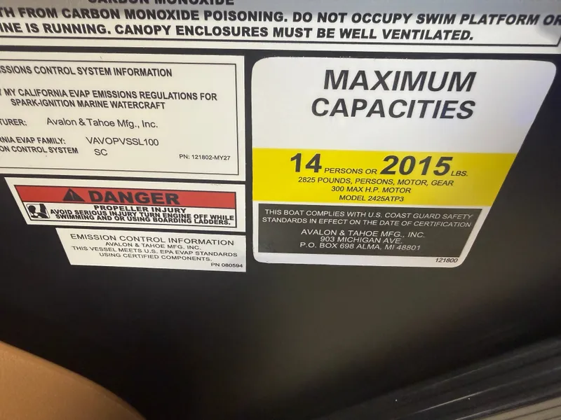 Slide: The Image of Capacity label: 14 persons or 2015 lbs. Includes carbon monoxide and emissions warnings. - 16