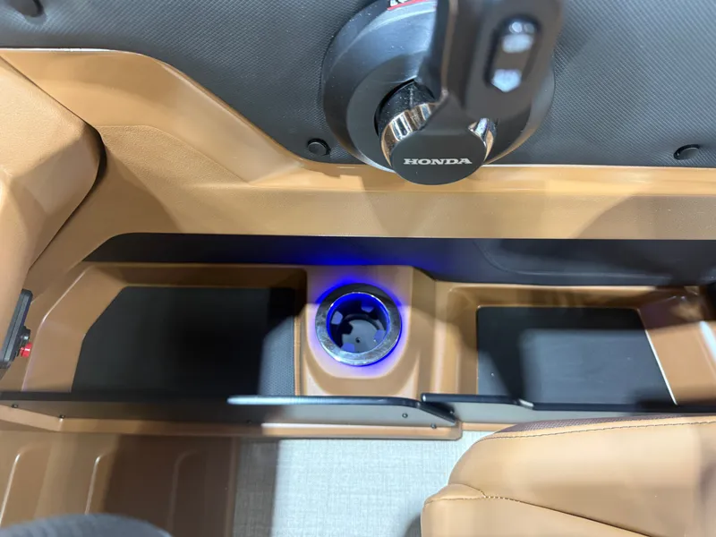 Slide: The Image of Close-up of a boat cockpit with Honda controls and an illuminated cup holder. - 15