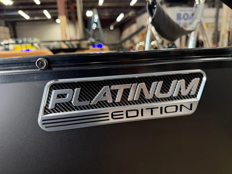 Slide: The Image of Platinum Edition emblem on a 2027 Tahoe LTZ 300HP VRB 2385 Swingback Tritoon. - 42