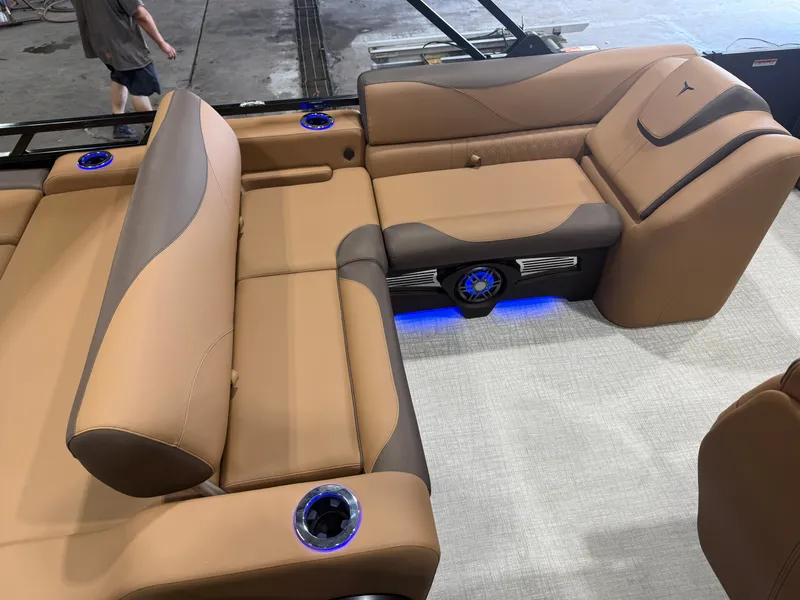 Slide: The Image of Luxurious beige leather seating on a modern boat with blue LED lighting and cup holders. - 17