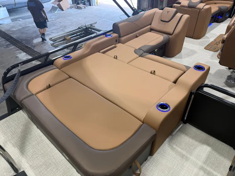 Slide: The Image of Luxurious beige upholstery on a modern boat with blue cup holders. - 19
