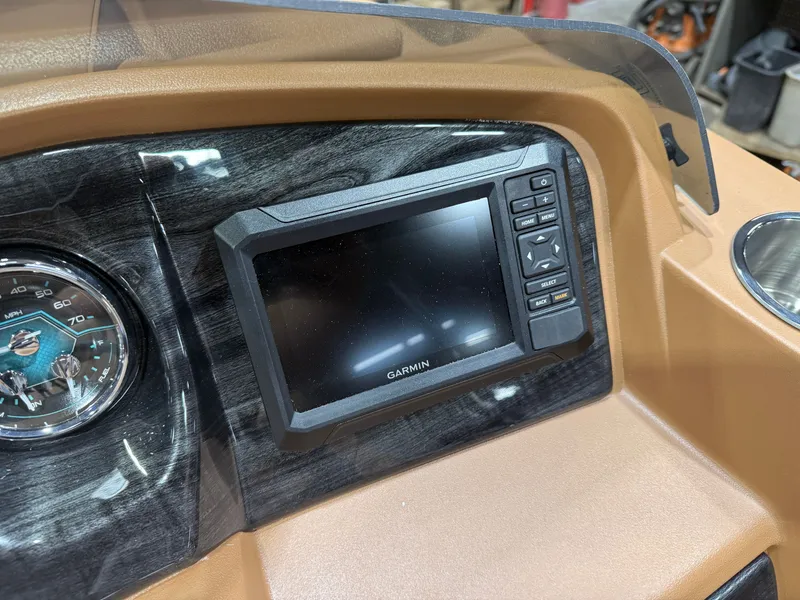 Slide: The Image of The image shows a modern boat dashboard with a Garmin screen and a tachometer. - 14