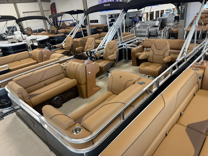 Slide: The Image of Interior view of a luxury pontoon boat with beige leather seating and modern fixtures. - 38