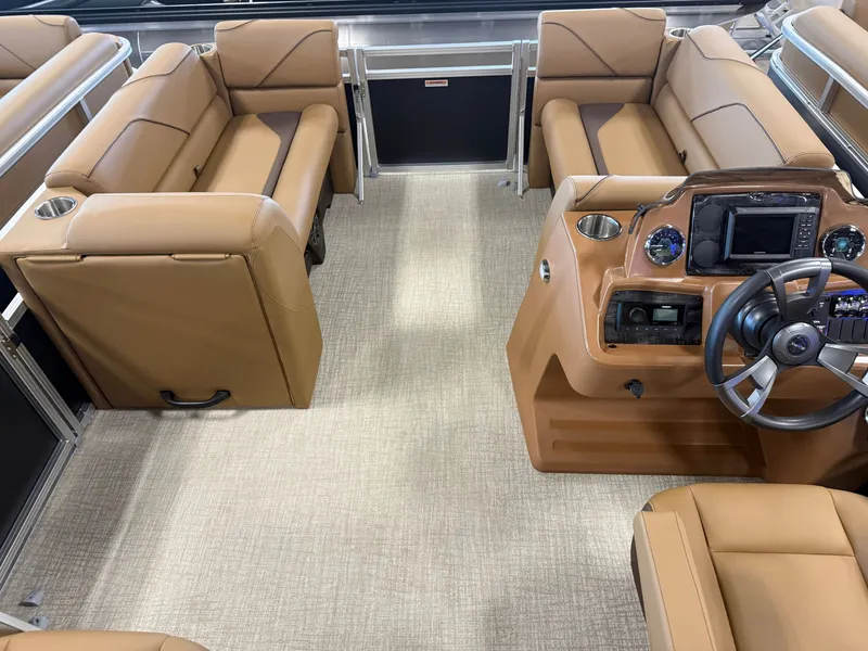 Slide: The Image of Interior of a modern pontoon boat with beige leather seating and a helm station with instruments. - 29