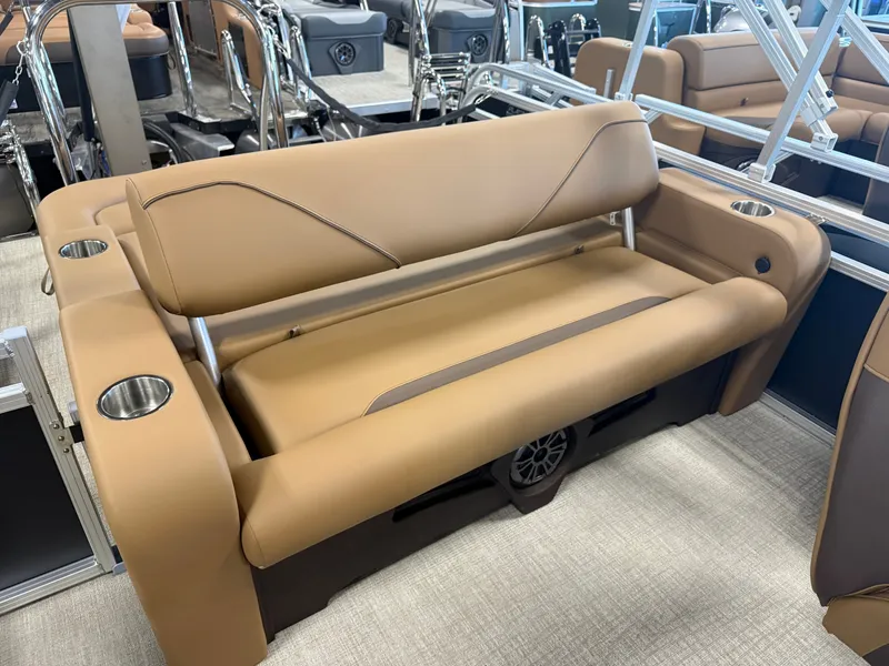 Slide: The Image of The image shows a luxurious boat seat with brown leather upholstery and built-in cup holders. - 18