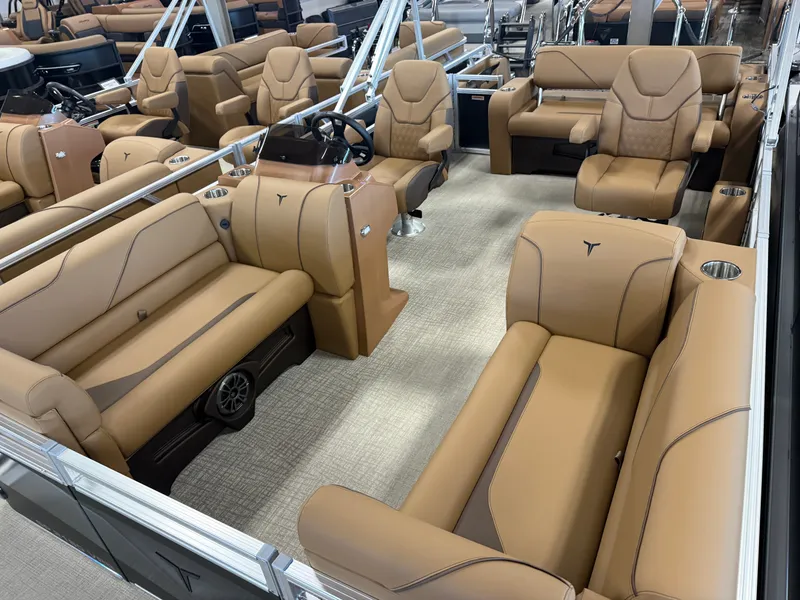 Slide: The Image of Interior view of a luxury pontoon boat with beige leather seating and a modern steering wheel. - 31