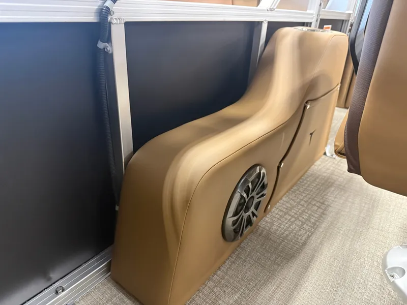 Slide: The Image of A sleek speaker in a brown casing on a boat. - 24
