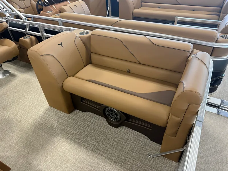 Slide: The Image of Luxurious brown leather seating on a modern boat with sleek details and a speaker underneath. - 9