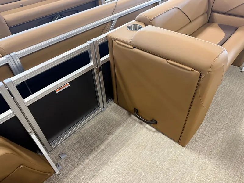 Slide: The Image of Brown leather seating with aluminum railing and built-in cup holder on a boat. - 25