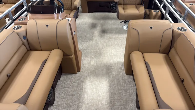 Slide: The Image of Interior of a luxury pontoon boat with beige leather seating and sleek armrests. - 6