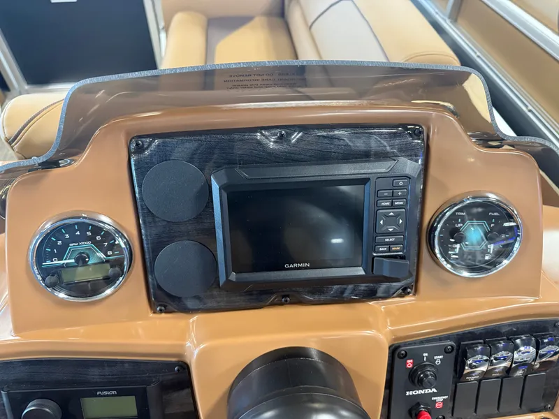 Slide: The Image of The image shows a boat cockpit with a Garmin navigation system and two round gauges. - 15