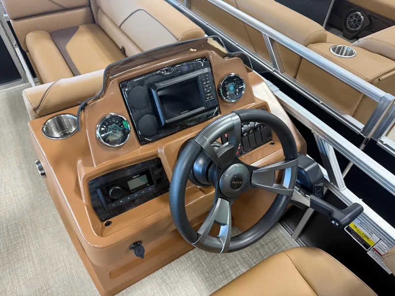 Slide: The Image of The image shows a modern boat cockpit with a sleek steering wheel and instruments. - 13