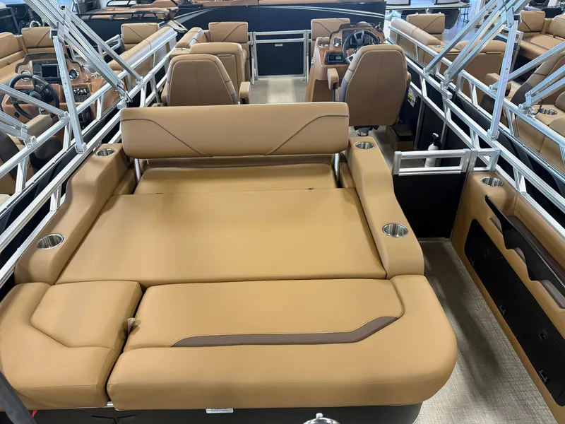 Slide: The Image of The image shows the interior of a modern pontoon boat with beige leather seating and stainless steel railings. - 5