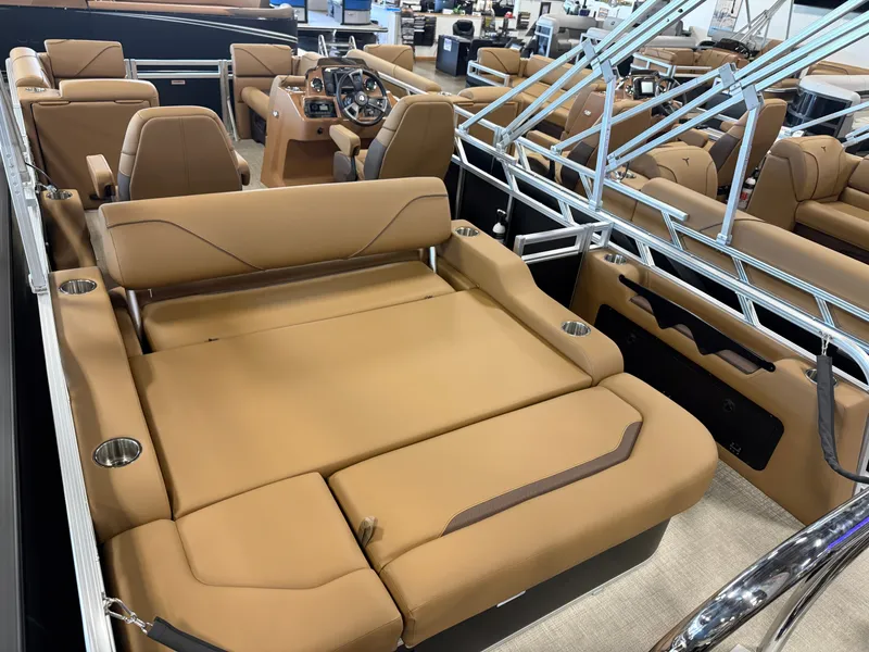 Slide: The Image of The image shows the interior of a modern pontoon boat with beige upholstery and stainless steel railings. - 21