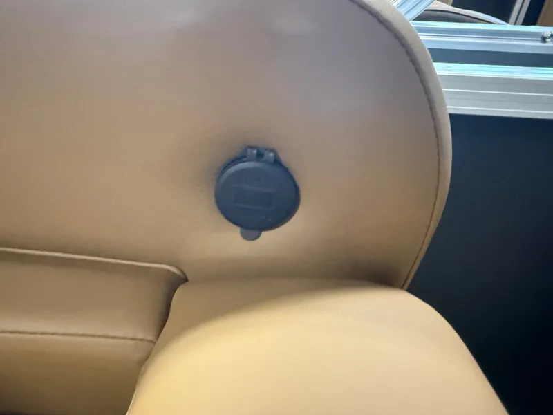 Slide: The Image of Close-up of a brown leather seat with a black socket. - 27