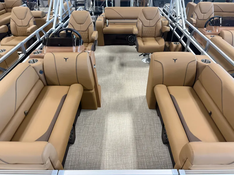 Slide: The Image of Interior of a modern pontoon boat with beige leather seating and sleek armrests. - 7