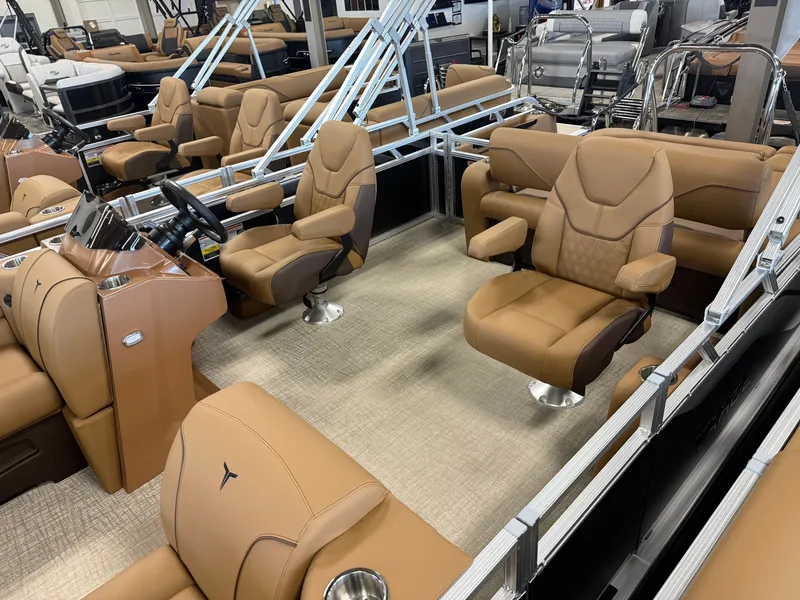 Slide: The Image of The image shows a modern boat interior with beige leather seats and a sleek helm station. - 3