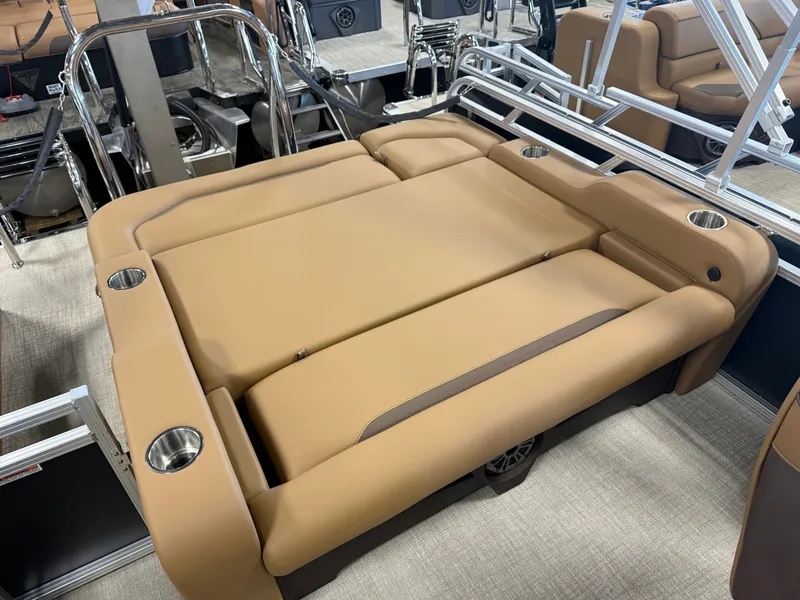 Slide: The Image of The image shows a luxurious beige lounging area on a boat with cup holders. - 19