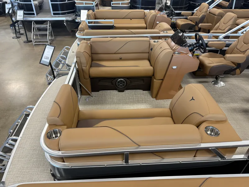 Slide: The Image of Interior view of a modern pontoon boat with beige leather seating and a sleek helm station. - 2
