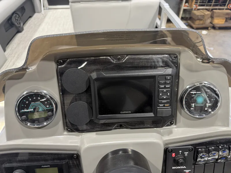 Slide: The Image of The image shows a boat dashboard with a Garmin navigation system and various gauges. - 15