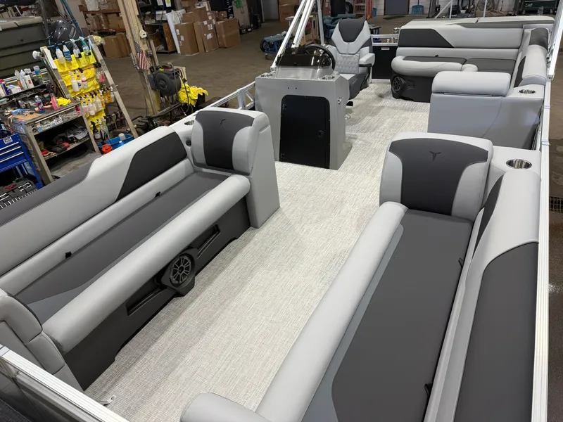 Slide: The Image of The image shows the spacious interior of a Tahoe Sport 2180 Cruise boat with gray seating. - 30