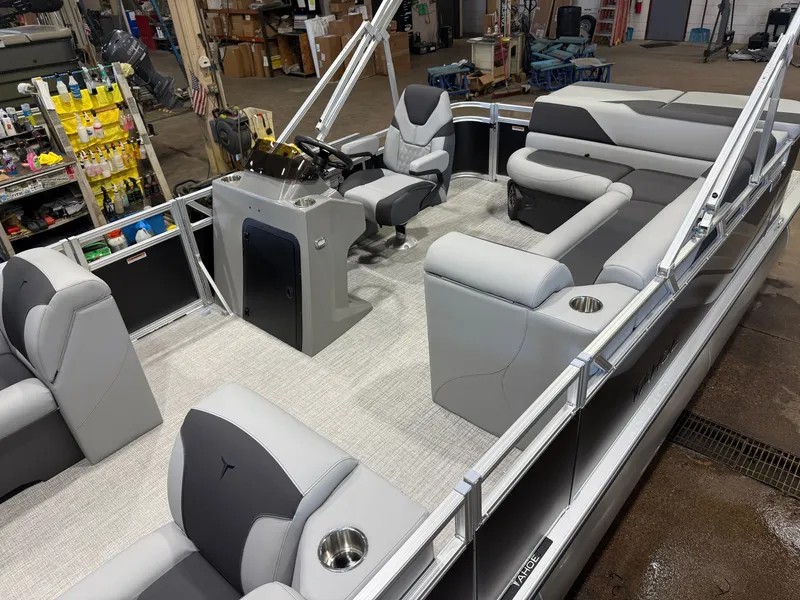 Slide: The Image of The image shows the interior of a modern pontoon boat with gray upholstery and a helm station. - 3