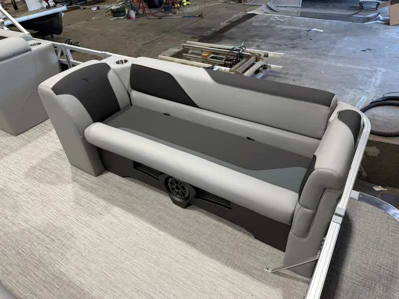 Slide: The Image of Gray and black bench seat on a boat with carpeted flooring. - 10