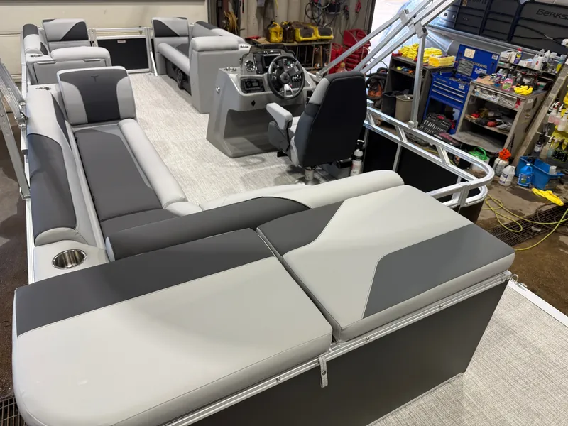 Slide: The Image of Interior of a modern pontoon boat with gray and white seating. - 22