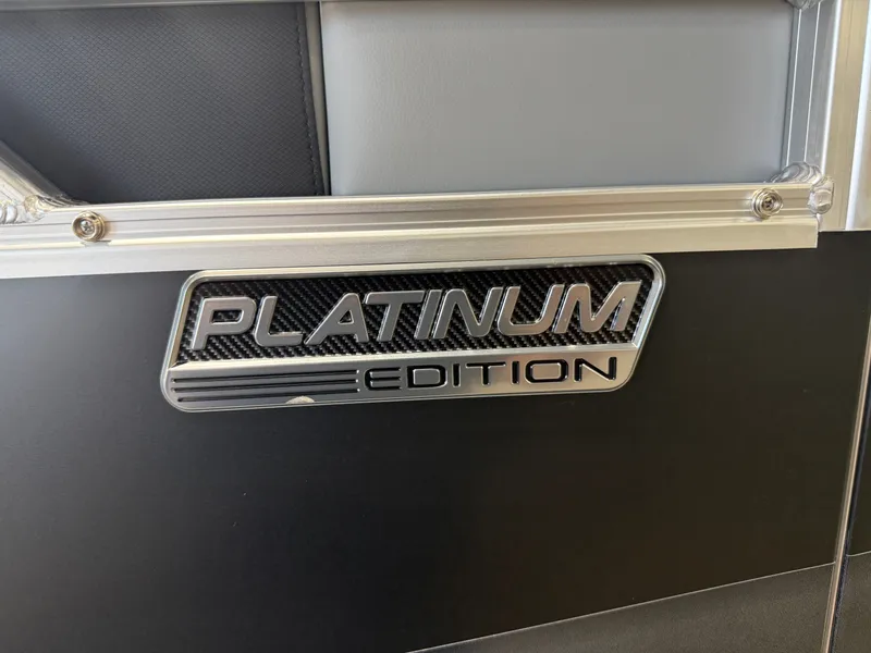 Slide: The Image of Close-up of a boat with a "Platinum Edition" emblem on a black surface. - 36