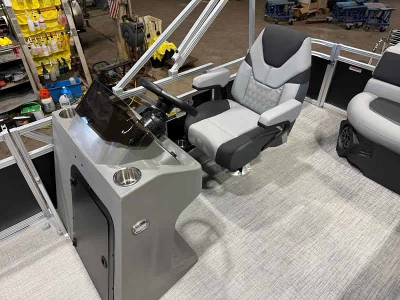 Slide: The Image of The image shows the helm of a modern boat with a comfortable captain's chair and sleek dashboard. - 11