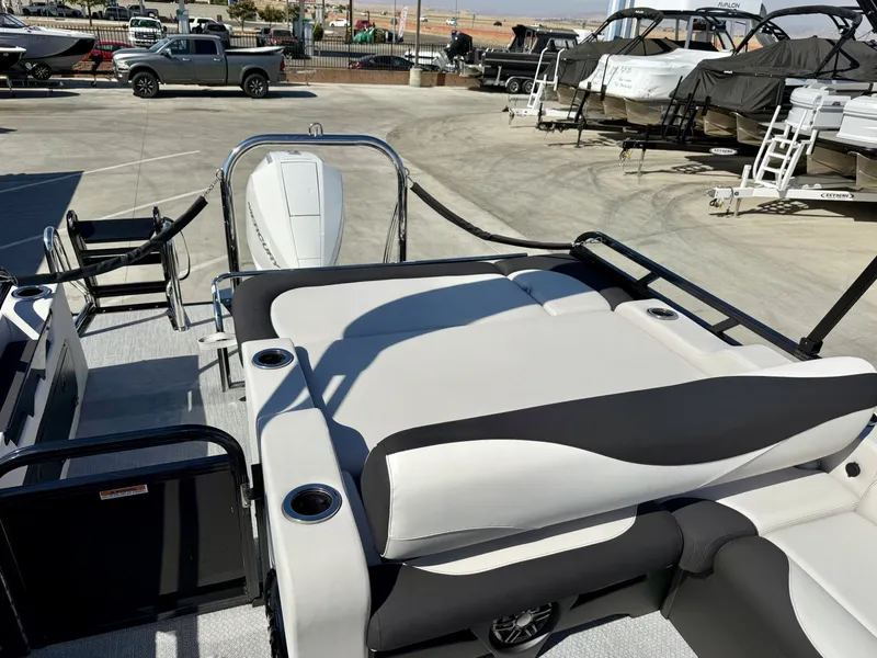 Slide: The Image of The image shows the deck of an Avalon 25' LSZ VRB with comfortable seating and cup holders. - 7