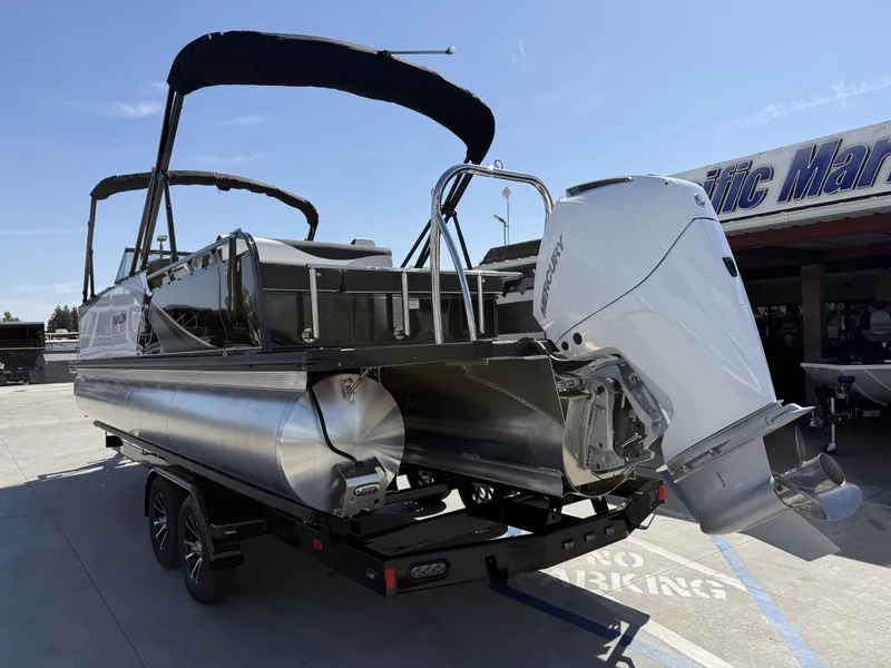 Slide: The Image of An Avalon 25' LSZ VRB with windshield and a 200HP Mercury engine on a trailer. - 6