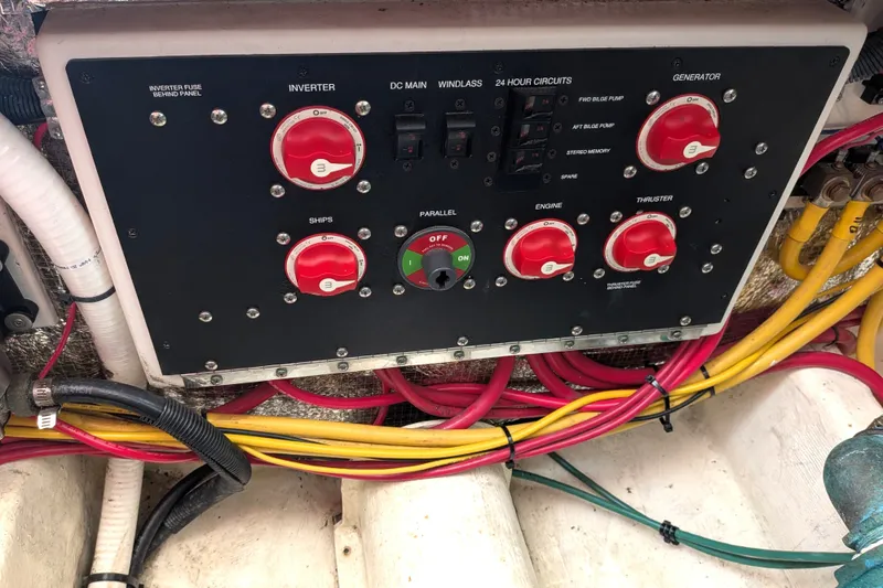 Slide: The Image of Electrical panel of a 2008 Back Cove 29 boat with labeled switches and wiring. - 46