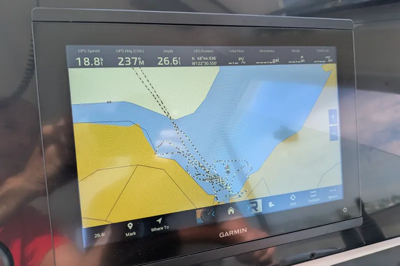 Slide: The Image of Garmin GPS display on 2008 Back Cove 29 showing navigation data and map. - 38