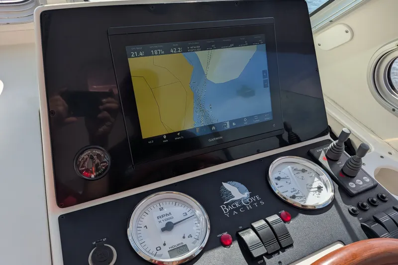 Slide: The Image of Helm of 2008 Back Cove 29 yacht with Garmin navigation display and gauges. - 41